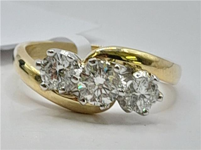 18ct gold diamond ring with 0.75ct diamonds, size L, featuring a sleek band and elegant design.
