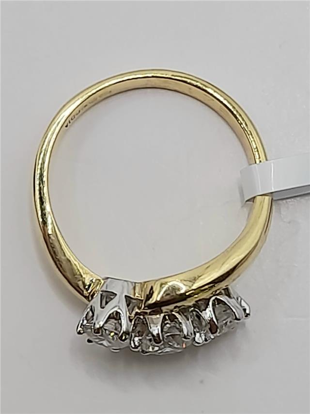 18ct gold diamond ring with 0.75 carats, size L, featuring a sleek band and sparkling diamonds.