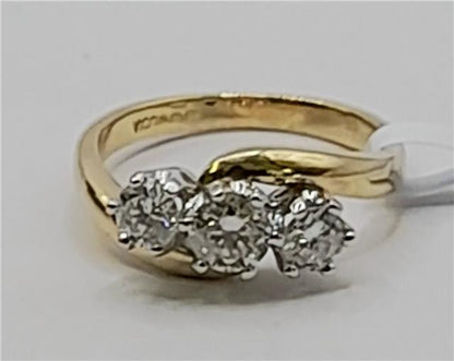 18ct gold diamond ring with 0.75 carats, size L, featuring a sleek band and sparkling stones.