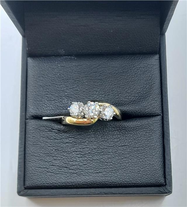 18ct gold diamond ring with 0.75ct stones, size L, featuring a polished band and sparkling diamonds.