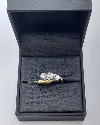 18ct gold diamond ring with 0.75 carat center stone in size L, featuring a sleek band and sparkling diamonds.