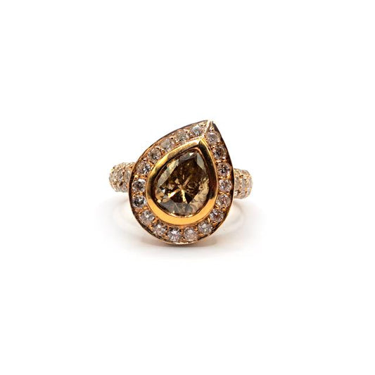 18ct rose gold ring featuring a 2.65 carat pear cut brown diamond, showcasing elegant design and sparkling gemstone.