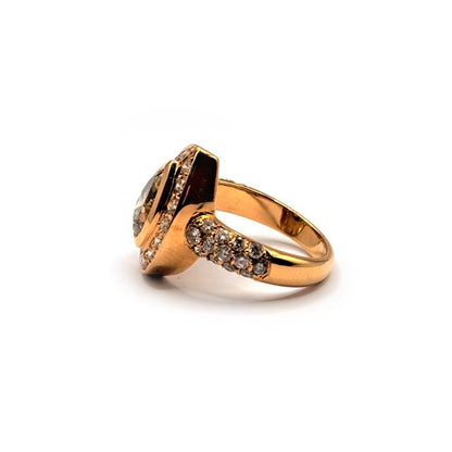 18ct rose gold ring with a 2.65 carat pear cut brown diamond, showcasing elegant gold band and sparkling gemstone.