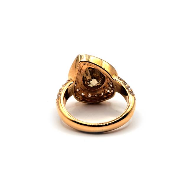 18ct rose gold ring featuring a 2.65 carat pear-cut brown diamond, elegant jewelry piece with a sleek design