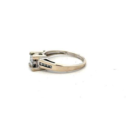 18ct white gold diamond ring with 0.33 carats, size L, featuring a sleek design and sparkling diamonds.