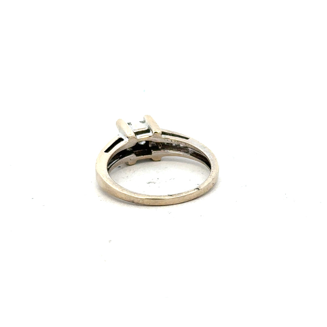 18ct white gold diamond ring with 0.33 carats, size L, featuring a sleek design and sparkling diamonds.