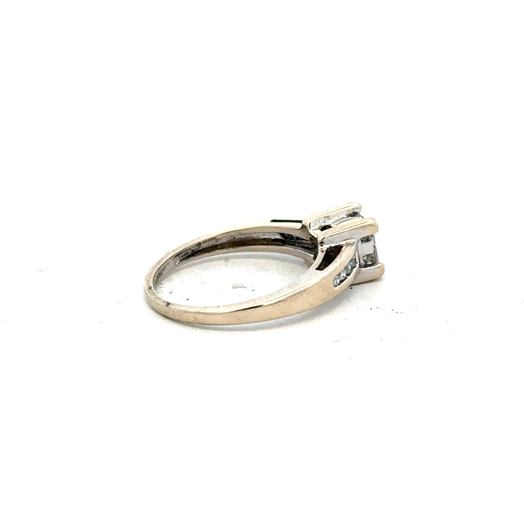 18ct white gold diamond ring with 0.33 carats, size L, featuring a sleek design and sparkling diamonds.