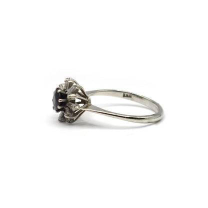 18ct white gold diamond cluster ring featuring 0.81 carats of sparkling diamonds, showcasing a luxurious and elegant design.