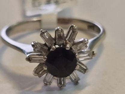 18ct white gold diamond cluster ring with 0.81 carats of sparkling diamonds, elegant jewelry piece.