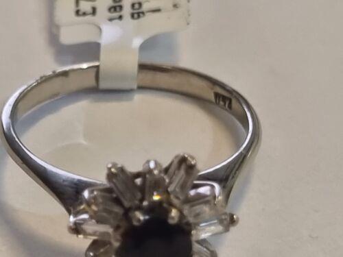 18ct white gold diamond cluster ring with 0.81 carats of sparkling diamonds, showcasing a luxurious and elegant jewelry piece.