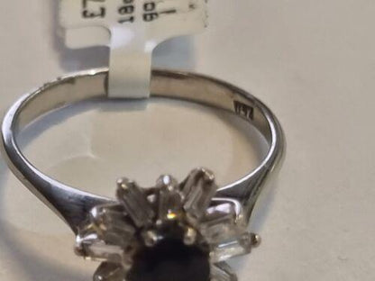 18ct white gold diamond cluster ring with 0.81 carats of sparkling diamonds, showcasing a luxurious and elegant jewelry piece.
