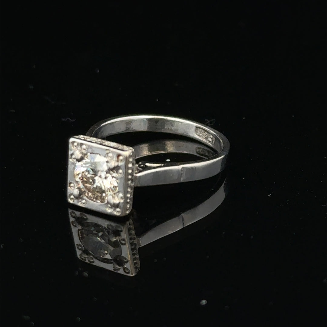 18ct white gold diamond ring with 0.89ct round diamonds, size L, showcasing a sleek, elegant design with a polished finish.
