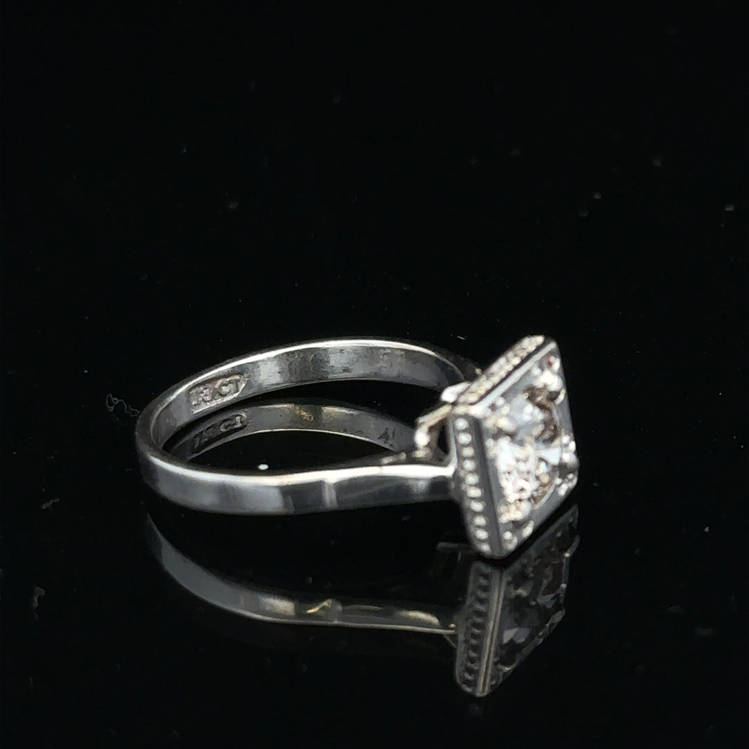 18ct white gold diamond ring with 0.89ct diamonds, size L, featuring a sleek band and elegant design.