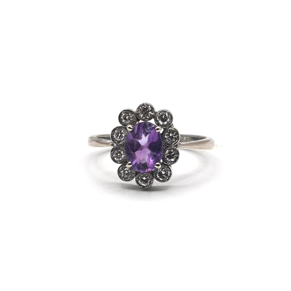 18ct white gold ring featuring a 1.00 carat amethyst and 0.30 carat diamond, size P1/2, with elegant setting and sparkling stones.
