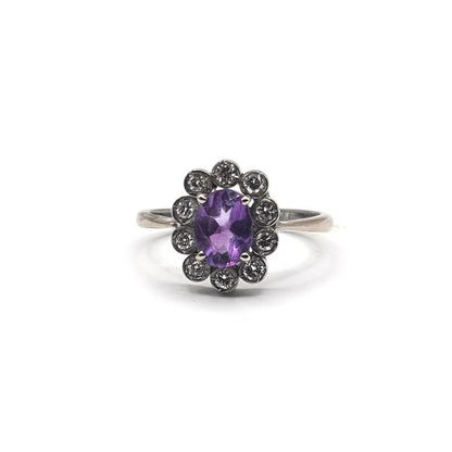 18ct white gold ring featuring a 1.00 carat amethyst and 0.30 carat diamond, size P1/2, with elegant setting and sparkling stones.