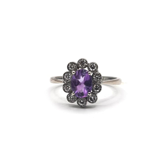 18ct white gold ring featuring a 1.00 carat amethyst and 0.30 carat diamond, size P1/2, with elegant setting and sparkling stones.