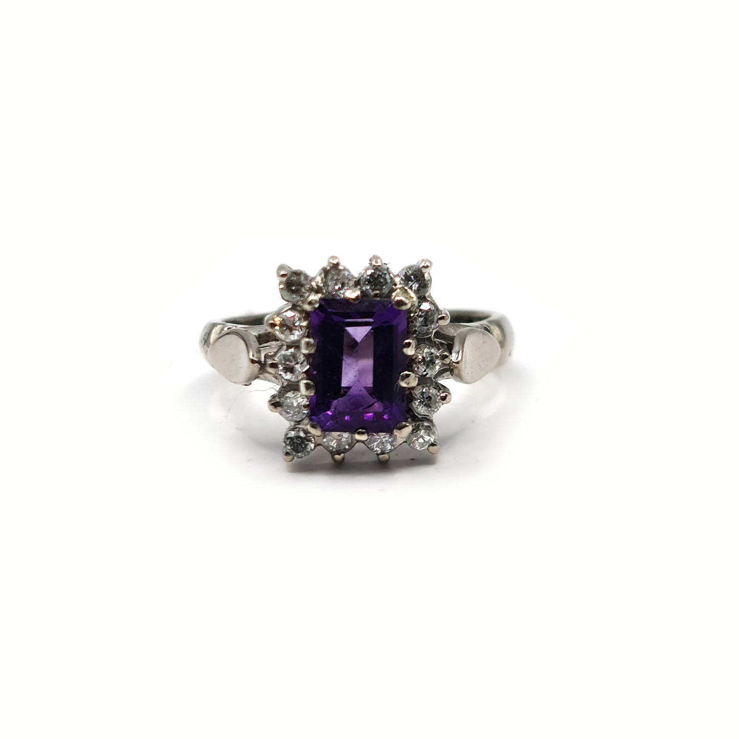 18ct white gold ring with a 1.05 carat emerald cut amethyst and 0.30 carat diamond accents, elegant jewelry design.