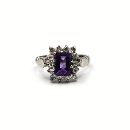 18ct white gold ring with a 1.05 carat emerald cut amethyst and 0.30 carat diamond accents, elegant jewelry design.