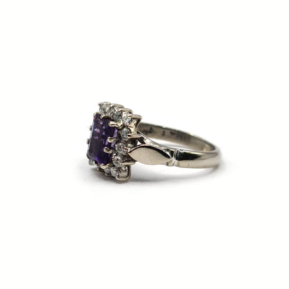18ct white gold ring with 1.05ct emerald cut amethyst and 0.30ct diamonds, showcasing a elegant gemstone design.
