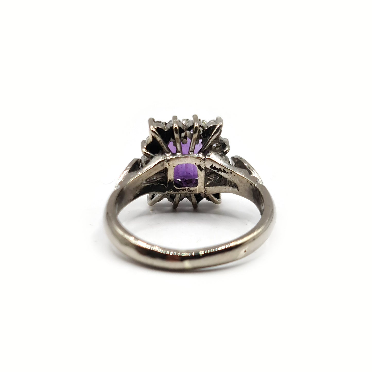 18ct white gold ring featuring a 1.05 carat emerald cut amethyst and 0.30 carat diamond accents.