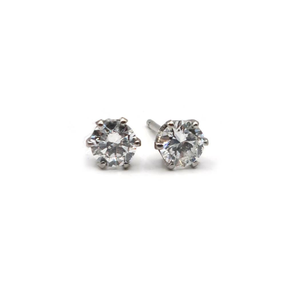 18ct white gold diamond stud earrings with a 1.09-carat single stone, featuring classic and elegant jewelry design.