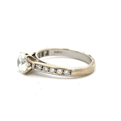 18ct white gold diamond ring with 1.135 carats, color I, clarity SI1, featuring a sparkling central diamond.