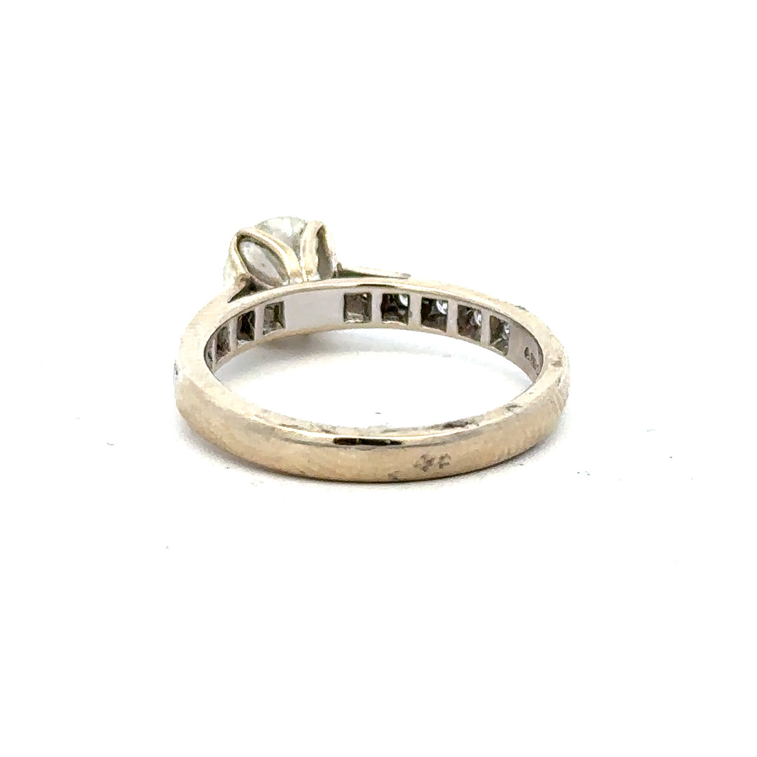 18ct white gold diamond ring with 1.135 carats, Color I, Clarity SI1, showcasing a sparkling central diamond.