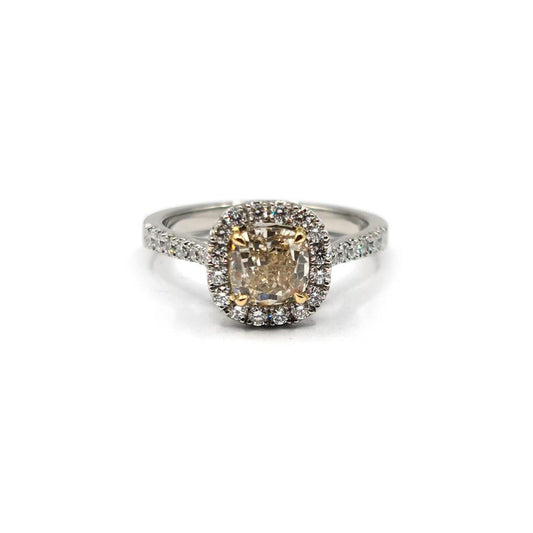 18ct white gold ring featuring a 1.15 carat fancy yellow diamond and 0.60 carat diamond halo setting, showcasing sparkling gemstone details.