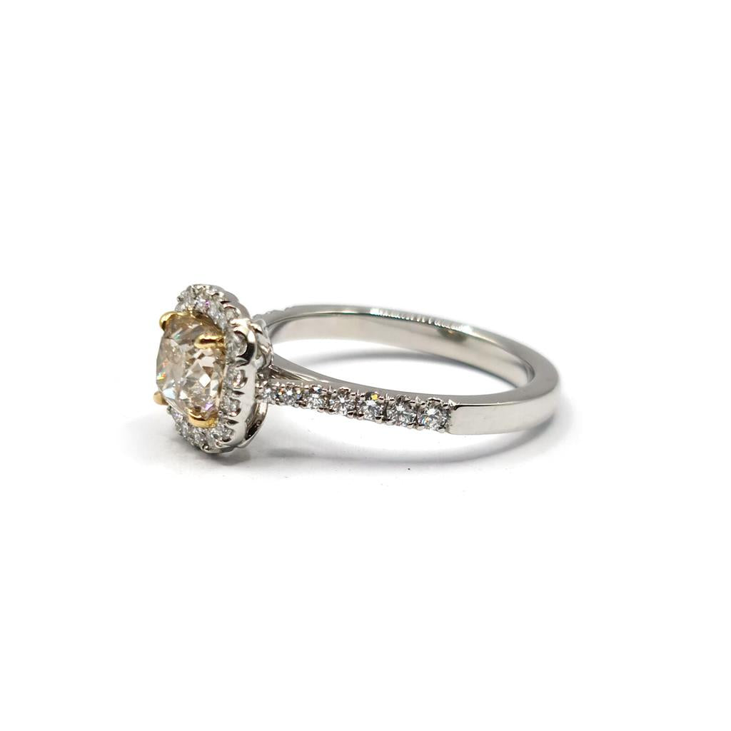 18ct white gold ring with 1.15ct fancy yellow diamond and 0.60ct diamond halo, featuring VS1 clarity, unbranded jewelry.