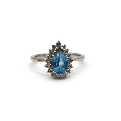 18ct white gold ring with a 1.90 carat pear-shaped topaz and 0.40 carat diamond accent, elegant jewelry design.