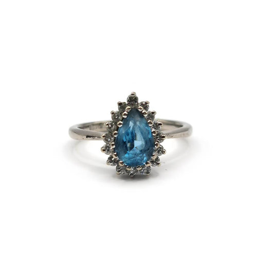 18ct white gold ring with a 1.90 carat pear-shaped topaz and 0.40 carat diamond accent, elegant jewelry design.