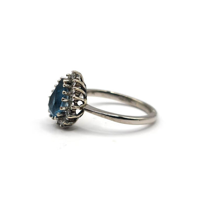 18ct white gold ring featuring a 1.90 carat pear-shaped topaz and 0.40 carat diamond accent.