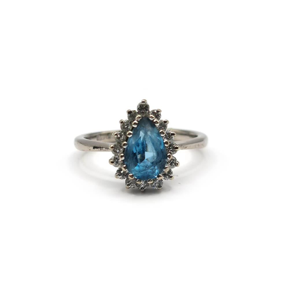 18ct white gold ring with a 1.90 carat pear-shaped topaz and 0.40 carat diamond accent, elegant jewelry design.