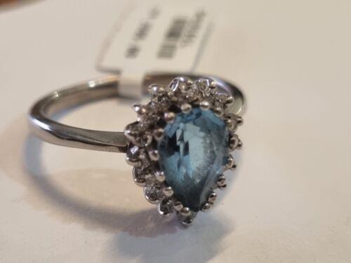 18ct white gold ring featuring a 1.90 carat pear-shaped cut topaz and 0.40 carat diamonds, elegant jewelry piece.