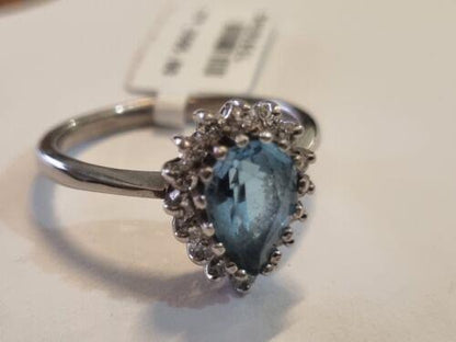 18ct white gold ring featuring a 1.90 carat pear-shaped cut topaz and 0.40 carat diamonds, elegant jewelry piece.