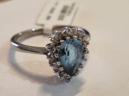 18ct white gold ring featuring a 1.90ct pear-shaped topaz and 0.40ct diamonds, elegant jewelry with detailed design.