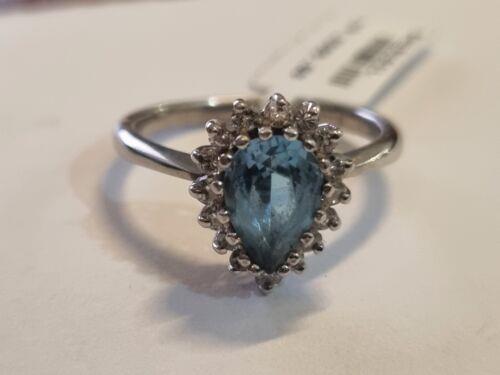 18ct white gold ring featuring a 1.90 carat pear-shaped topaz and 0.40 carat diamond accents, elegant jewelry piece.