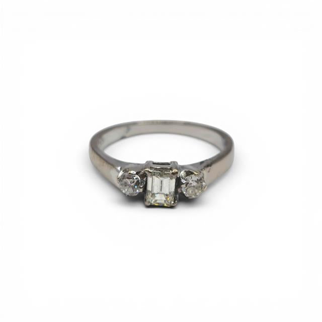 18ct white gold ring with three sparkling diamonds, showcasing elegant craftsmanship and a sleek, polished finish.