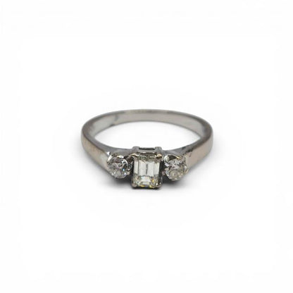 18ct white gold ring with three sparkling diamonds, showcasing elegant craftsmanship and a sleek, polished finish.