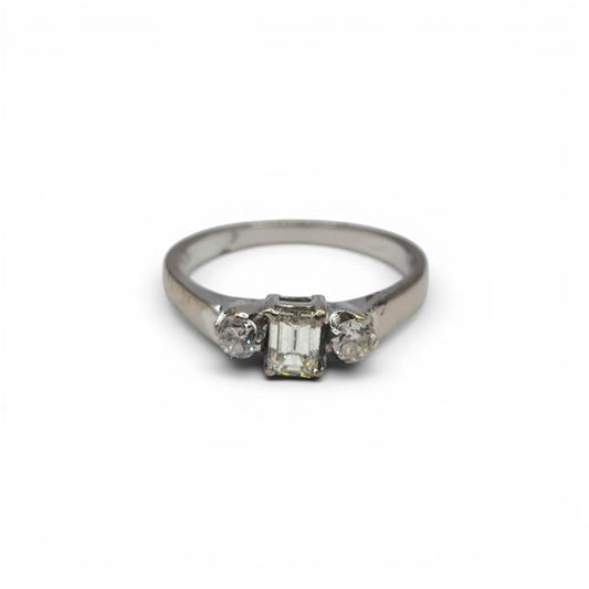 18ct white gold ring with three sparkling diamonds, showcasing elegant craftsmanship and a sleek, polished finish.