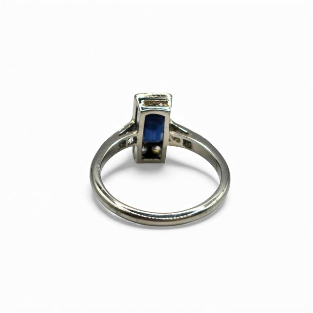 18ct white gold and platinum ring with diamonds and sapphires, showcasing a detailed design and sparkling gemstones.
