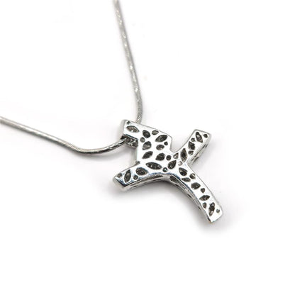 18ct white gold chain with 0.65 carat diamond twist design cross, showcasing elegant jewelry craftsmanship.