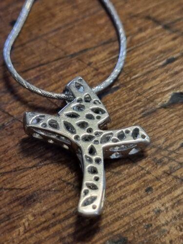 18ct white gold chain with 0.65 carat diamond twist design cross, elegant jewelry piece featuring sparkling diamonds and intricate craftsmanship.