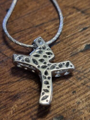 18ct white gold chain with 0.65 carat diamond twist design cross, featuring a sleek and elegant jewelry piece.
