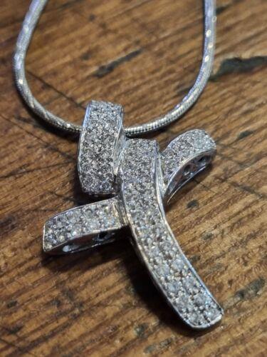 18ct white gold chain with 0.65 carat diamond twist design cross, showcasing elegant jewelry craftsmanship.