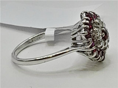18ct white gold diamond and ruby ring featuring a central ruby gemstone and sparkling diamonds, elegant jewelry accessory.