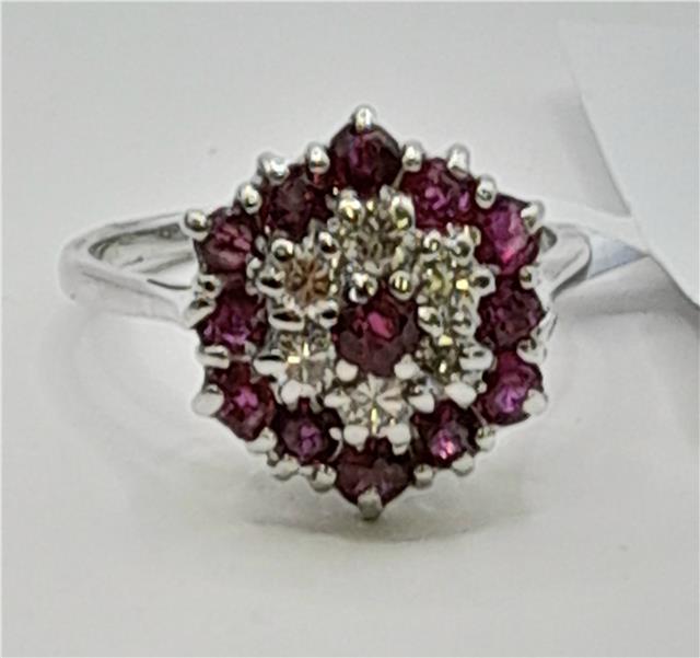 18ct white gold ring featuring diamonds and rubies, showcasing a sparkling gemstone design with elegant craftsmanship.