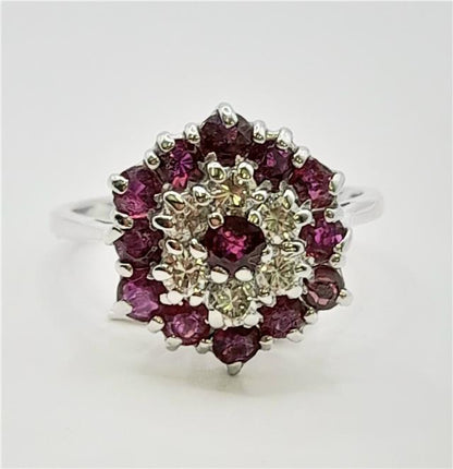 18ct white gold diamond and ruby ring with sparkling gemstones, elegant jewelry piece featuring a sleek design and vibrant red rubies.