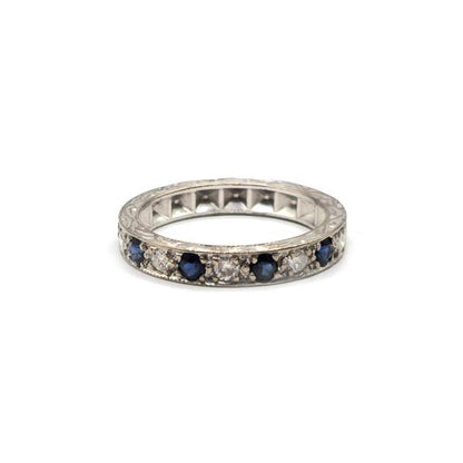 18ct white gold diamond and sapphire half eternity ring with alternating gemstone setting, elegant jewelry piece.
