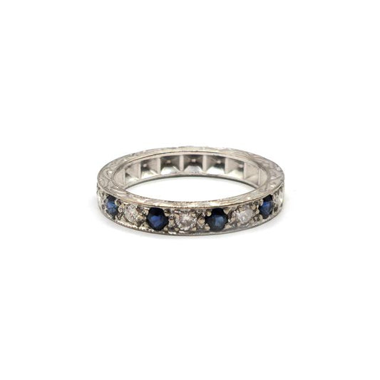 18ct white gold diamond and sapphire half eternity ring with alternating gemstone setting, elegant jewelry piece.